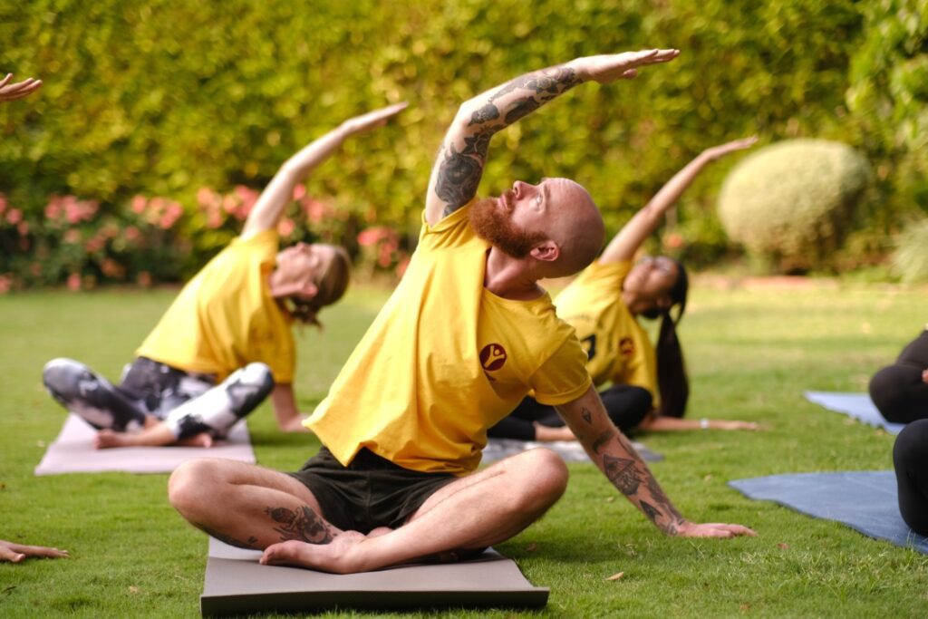 Practices to live healthier, overcome limitations, such as yoga poses which are being done by the students in this picture.