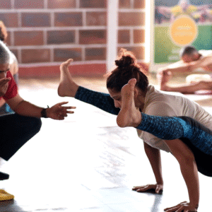 Woman practicing beginner yoga for health and balance at yoga institute Mysore