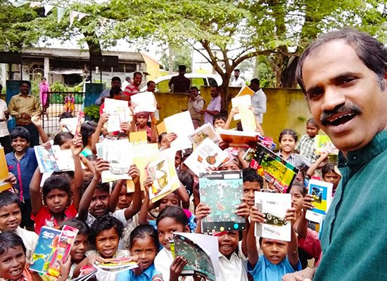 bharatha foundation charitable trust. donation to school children. kids showing their school kits they received as a part of donation