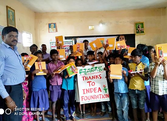 bharatha foundation charitable trust. donation to school children. children holding a thank you Bharatha foundation banner