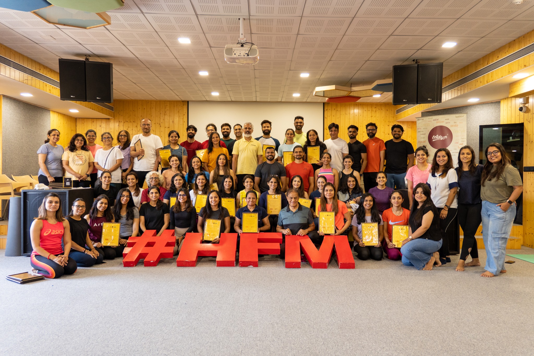 group picture of students with certificates after finishing a yoga workshop with bharat shetty