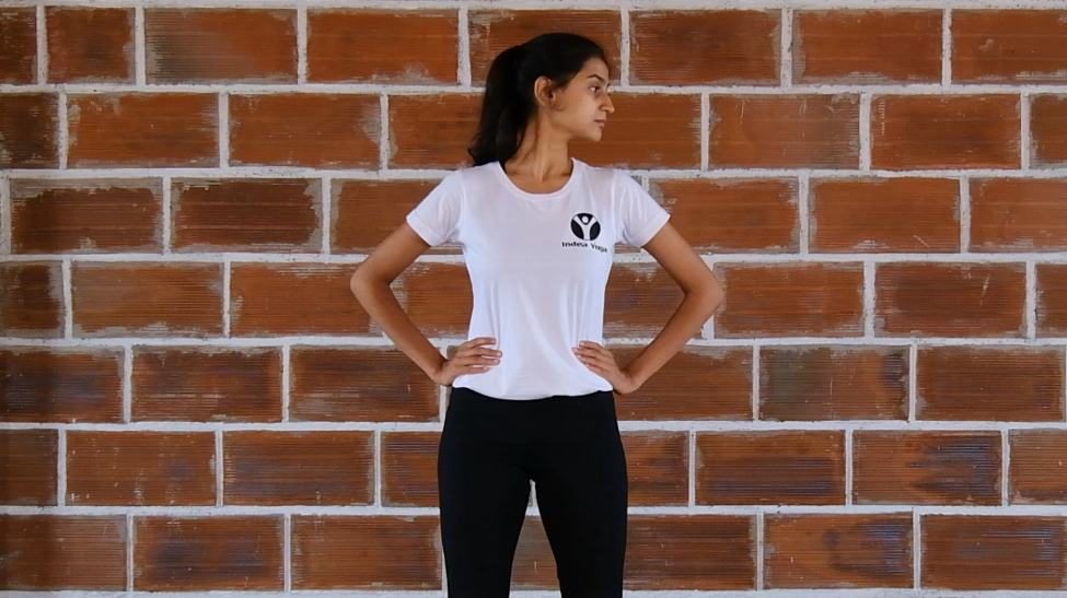 yoga student demonstrating Neck Bending side to side is a beginner yoga pose and can be practiced by everyone.